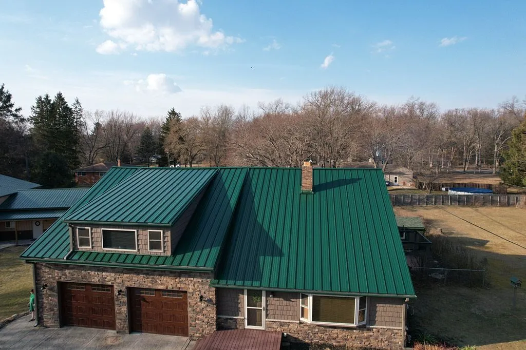 front view of new green standing seam metal roof