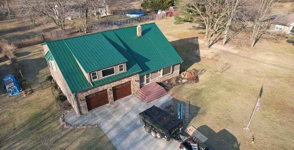 green standing seam metal roof after replacement