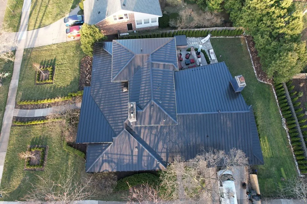 Brand new stealth black standing seam metal roof installed by Shingle and Metal Roofs LLC
