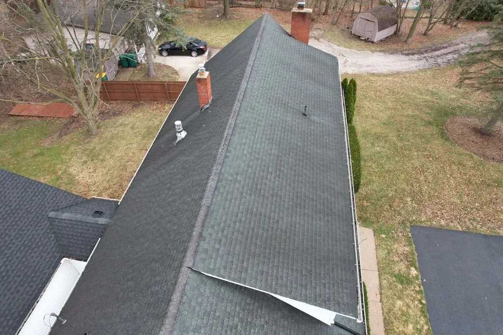ridge view of older asphalt roof before replacement