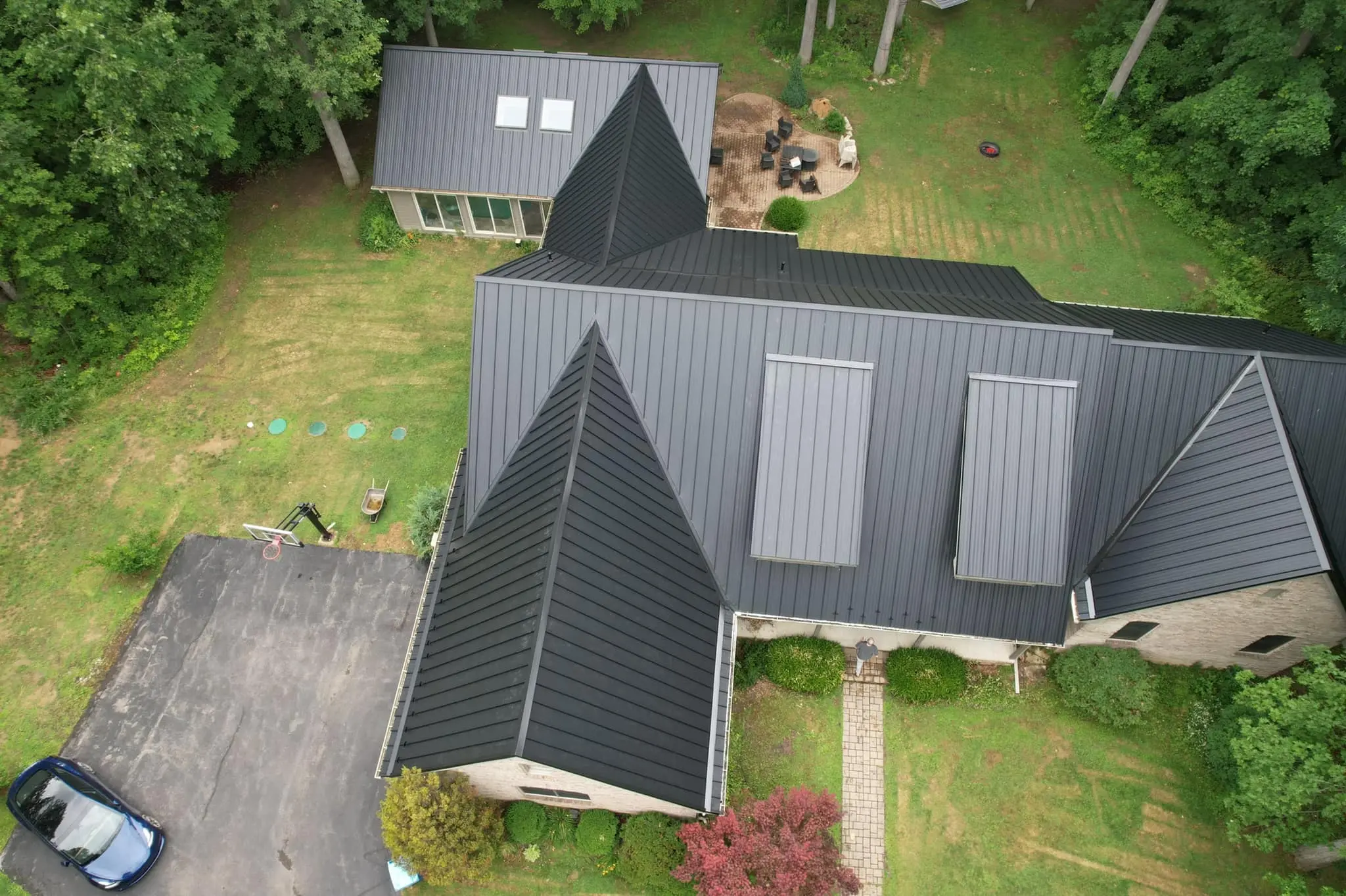 dark grey standing seam metal roof house