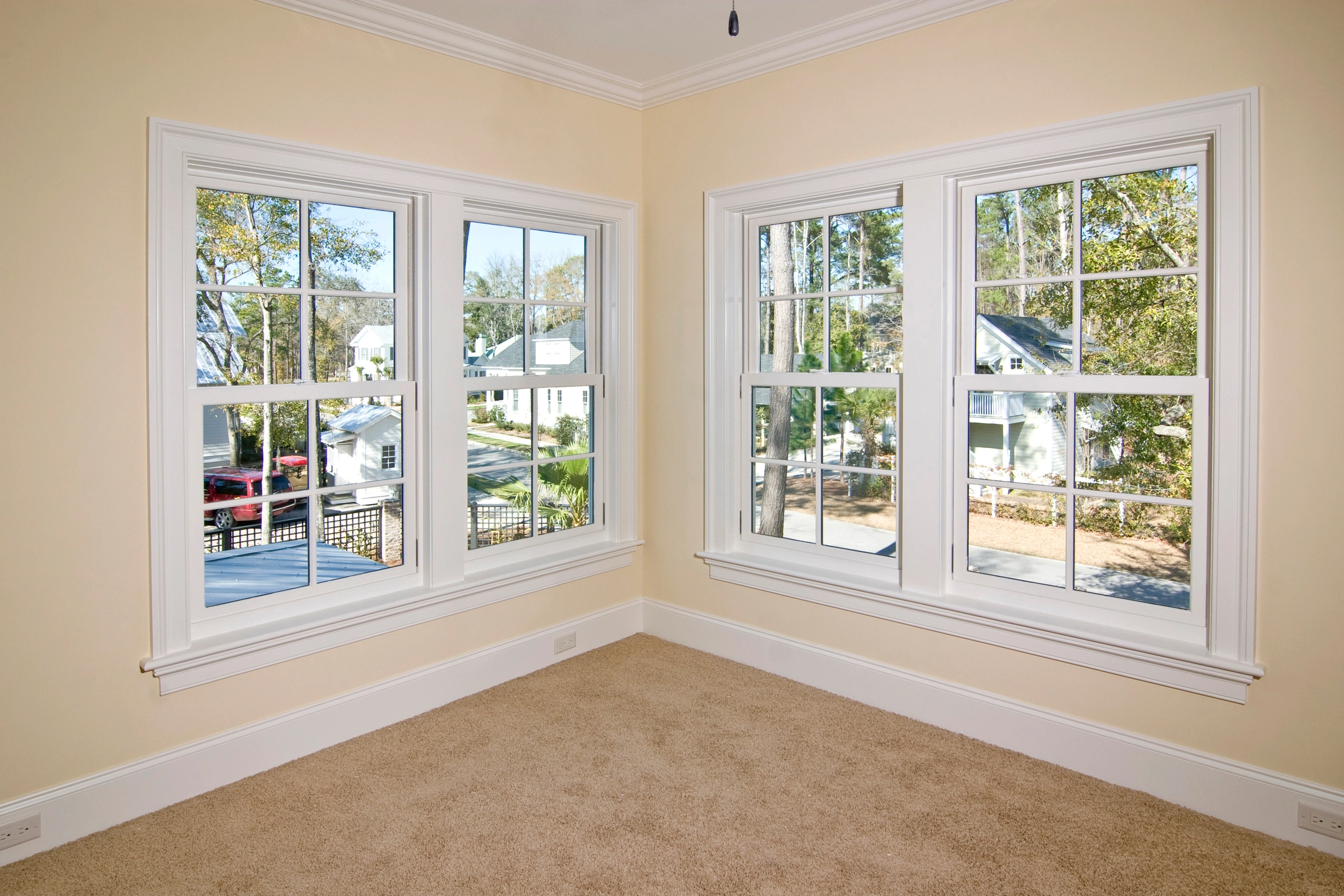 columbus window replacement with white frames on yellow walls