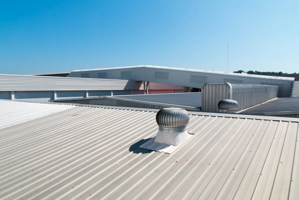 Aluminum roof of a large building with a vent on