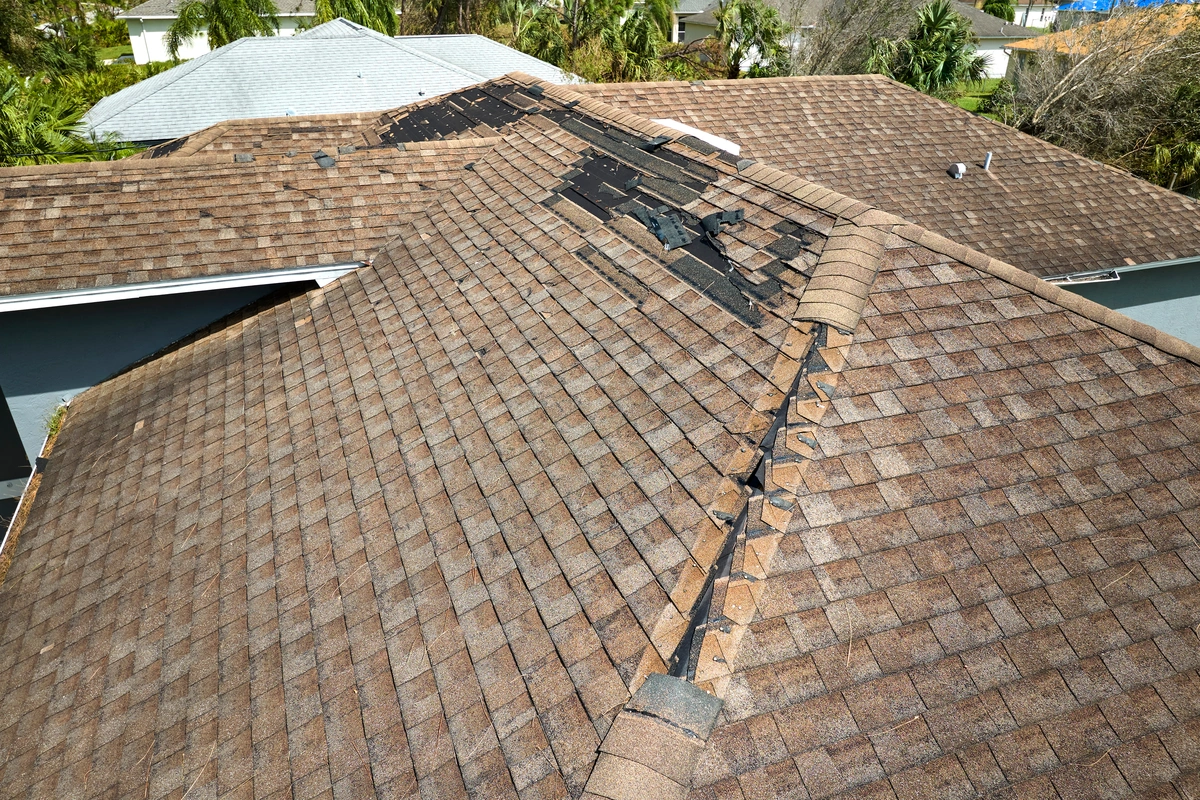 house roof with granule loss and damage