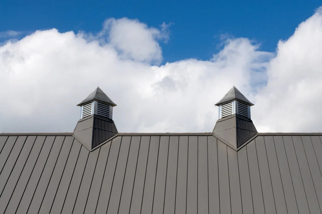 two roof vents next to each other on a modern house roof 