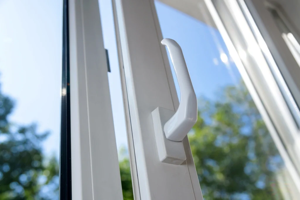 closeup of vinyl windows installed to replace wood windows