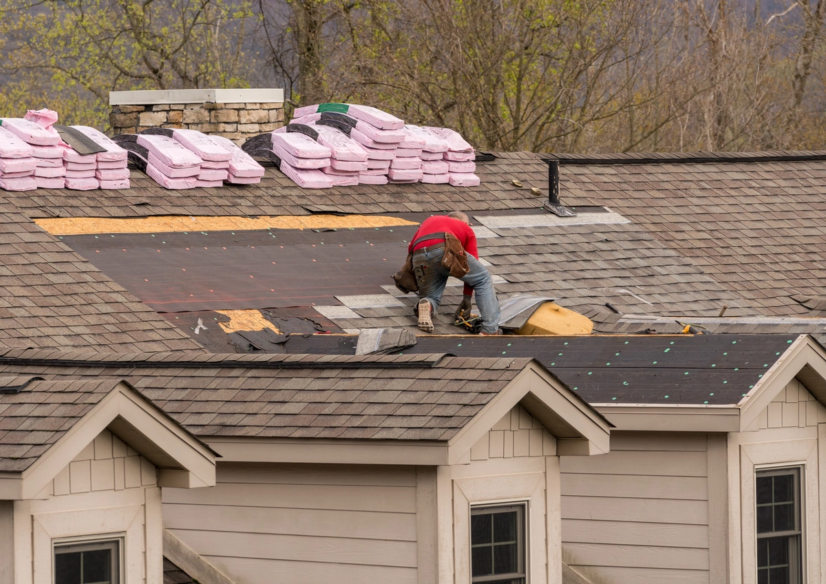 roofer repairing a small portion of a roof