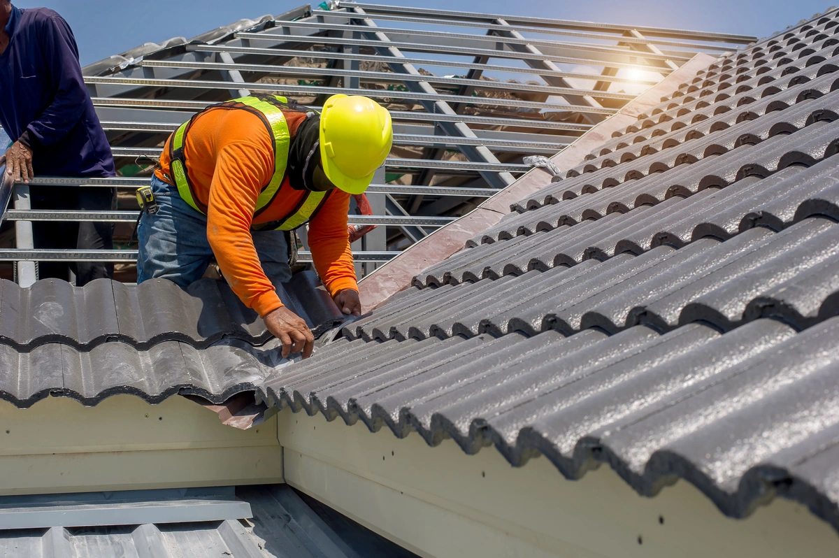 tile roof repair by worker