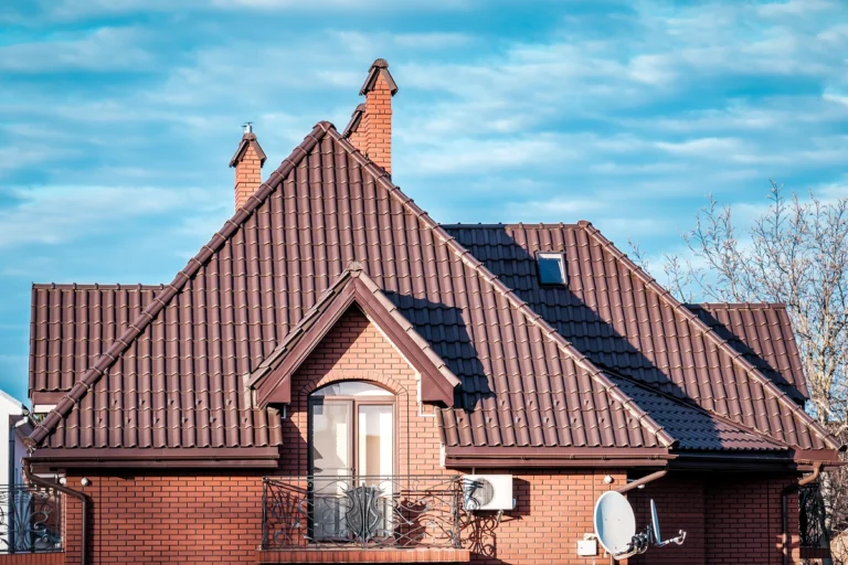 house gable roof with brown metal tiles