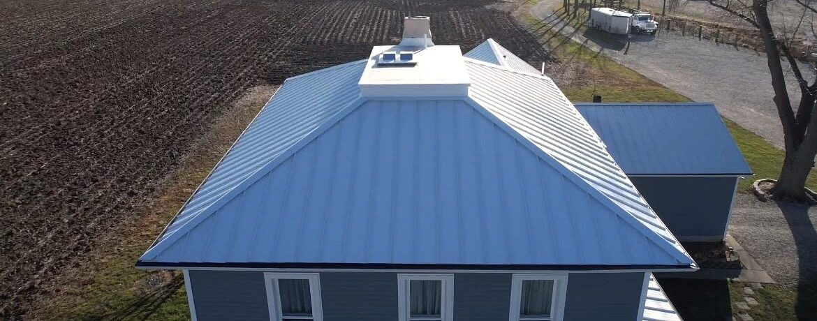 Polar white standing seam metal roofing with Shingle and Metal Roofs LLC in-house metal.