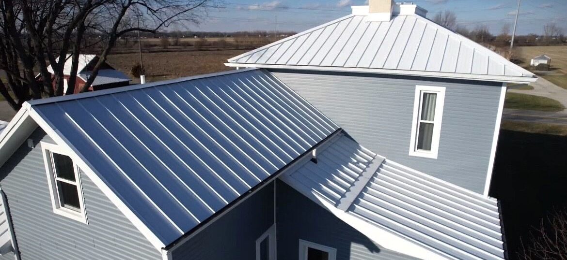 Metal roofing replacement done by Shingle and Metal Roofs LLC featuring Polar white standing seam metal.