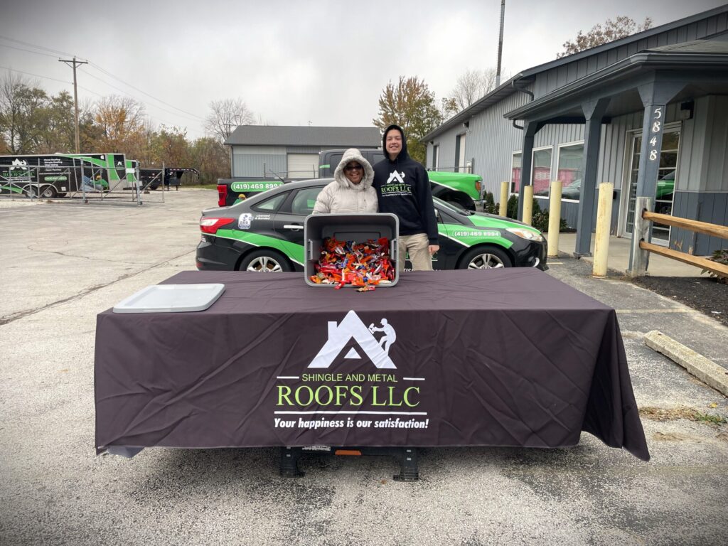 Shingle and Metal Roofs employees during trick or treat event at office located in Toledo, Ohio